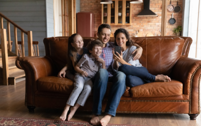 Family on lounge looking at smartphone